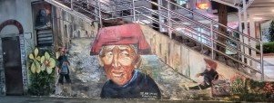 Welcome to our World mural by Belinda Low at Blk 4 ground floor stairs.