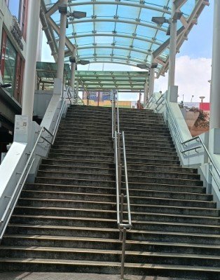 Stairs to overhead bridge from Pagoda St to People's Park Complex.