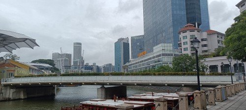 Crossing the Singapore River by using the Read Bridge that is beside Paradox Singapore.