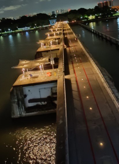 Cross the Marina Barrage Bridge and Dam.