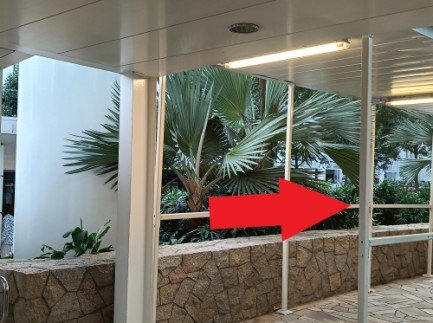 Turn right and follow the covered walkway.