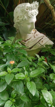 A white bust of Apollo, the Greek god of music, poetry, and light.