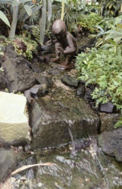 Little Girl with Shell by VANESSA MARSTON at the National Orchid Garden.