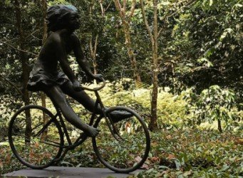 Girl on a Bicycle by Sydney Harpley.