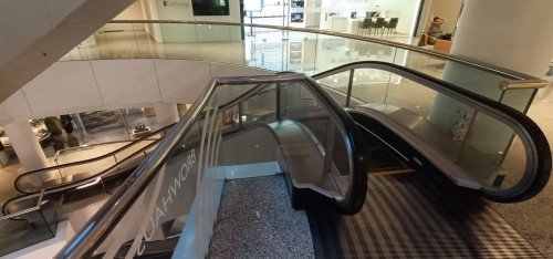Wheelock Place Curved Escalator.