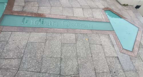 Arrow on the floor that is pointing to the Indian Ocean.