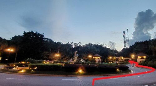 Walk past the Dolphin Fountain on the right side and go up the slope along Cove Avenue.