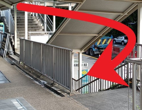 Climb down the stairs from the overhead bridge and then go down the stairs in front to the street level and continue walking straight towards Travelodge HarbourFront, which will be on your left.