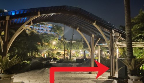 Walk back towards the arch, turn right and follow the sheltered walkway.