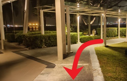 Walk from the sheltered walkway onto the unsheltered walkway.