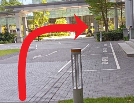 Walk to the sheltered walkway, turn right and continue walking.