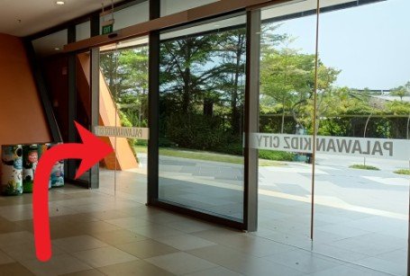 Turn right and exit the building.