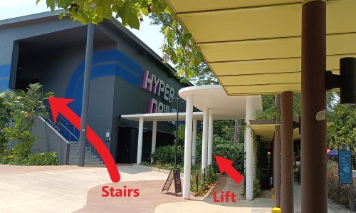 Turn left, go up the lift or walk up the stairs and enter the HYPER DRIVE building if you are up to some go kart racing fun.