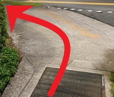 Follow the walkway to the intersection and turn left.