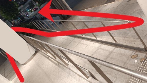 Go down the slope and walk straight by the side of the VivoCity Mall without entering.